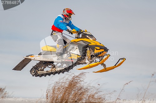 Image of High jump of sportsman on snowmobile