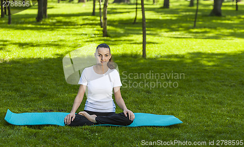 Image of Girl Relaxing in a Green Park