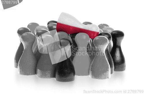 Image of One unique pawn on top of common pawns