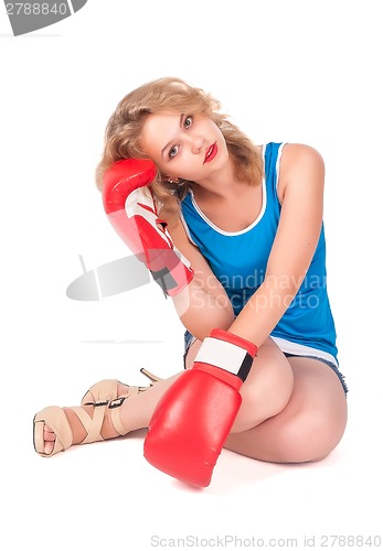 Image of Pretty sad girl with boxing gloves