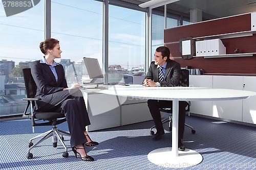 Image of businesswoman working in her office vv