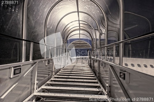 Image of White gangway interior for an airplane