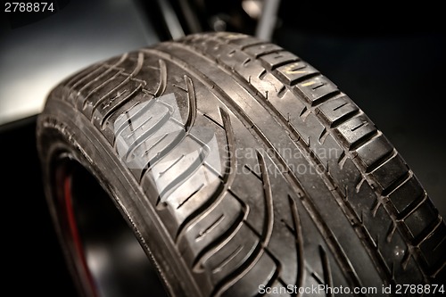 Image of New car tyre closeup photo