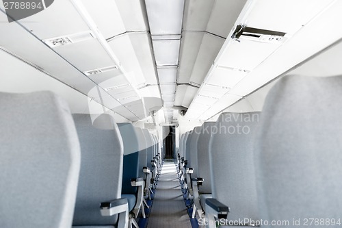 Image of Interior of an airplane with many seats