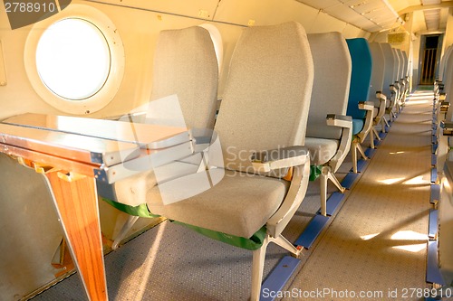 Image of Interior of an airplane with many seats