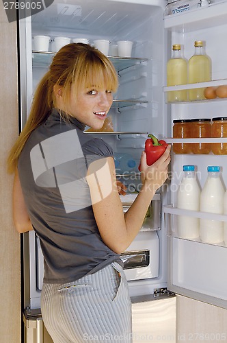 Image of woman and fridge l