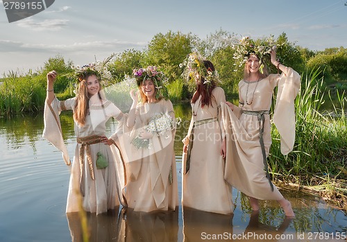 Image of Beautiful women with flower wreath in water