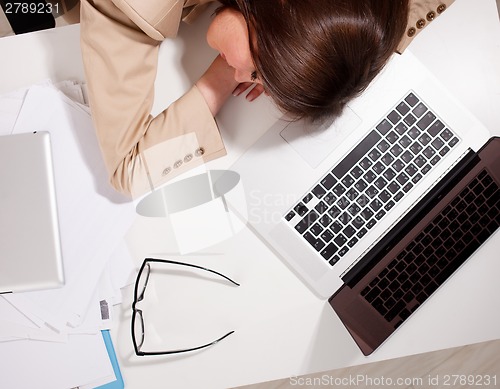 Image of woman sleeps with computer