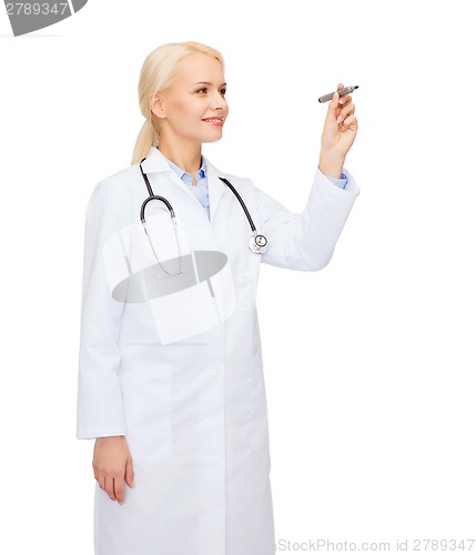 Image of female doctor working with something imaginary