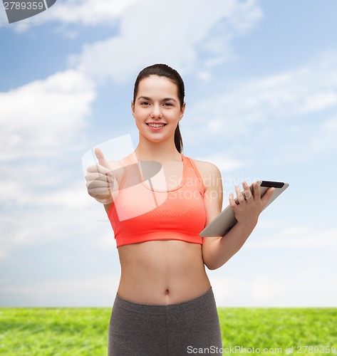 Image of sporty woman with tablet pc computer