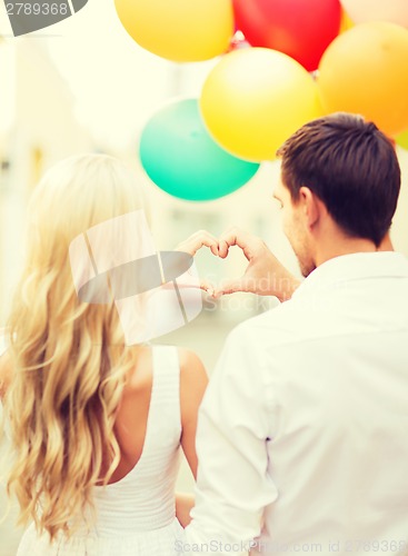 Image of couple with colorful balloons