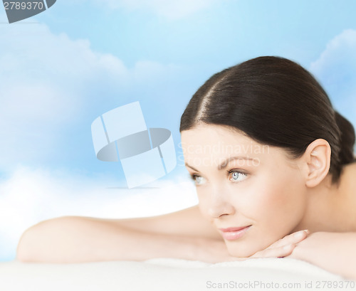 Image of smiling woman in spa salon