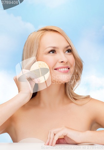 Image of beautiful woman with sponge