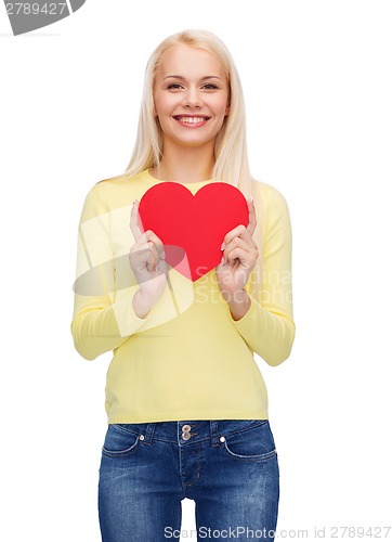 Image of smiling woman with red heart