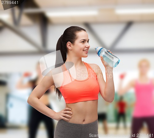 Image of sporty woman with water bottle