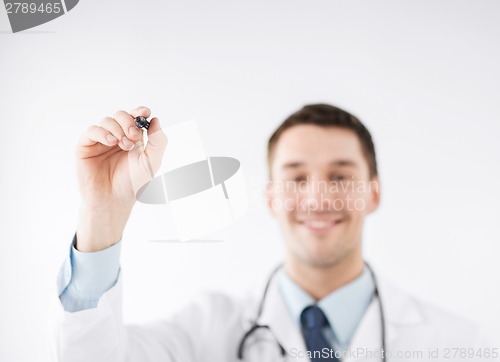Image of doctor writing something in the air