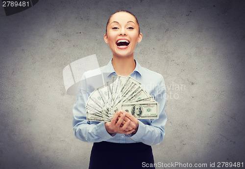 Image of young businesswoman with dollar cash money