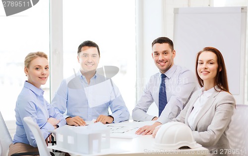 Image of happy team of architects and designers in office