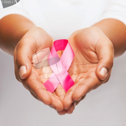Image of hands holding pink breast cancer awareness ribbon