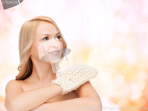 Image of smiling woman with exfoliation glove