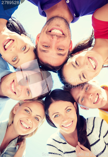 Image of group of teenagers looking down