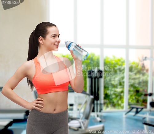 Image of sporty woman with water bottle