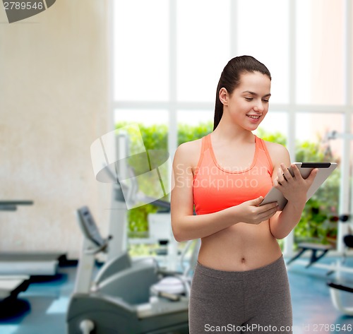 Image of sporty woman with tablet pc computer
