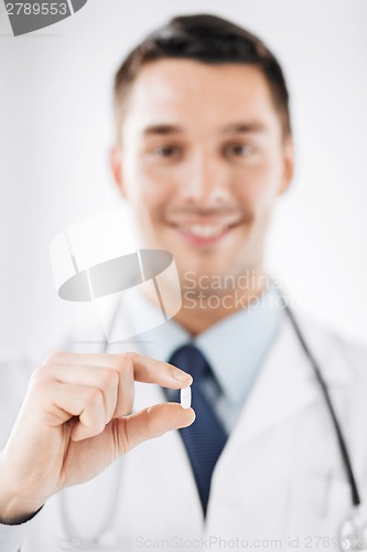 Image of doctor with pill in hospital