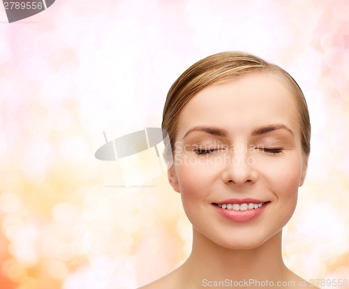 Image of face of beautiful woman with closed eyes