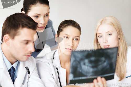 Image of group of doctors looking at x-ray