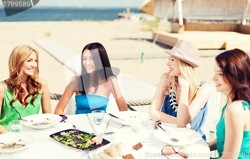 Image of girls in cafe on the beach