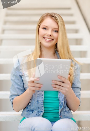 Image of smiling female student with tablet pc computer