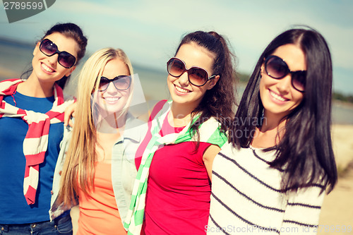 Image of beautiful teenage girls having fun on the beach