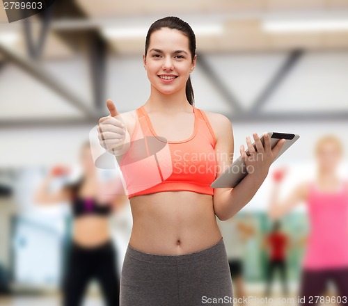 Image of sporty woman with tablet pc computer
