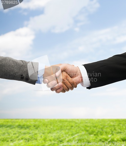 Image of businessman and businesswoman shaking hands