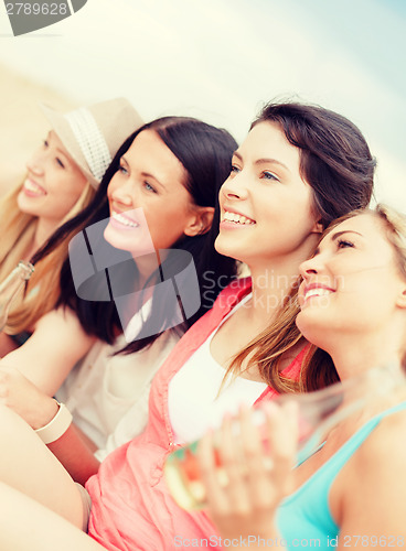 Image of girls with drinks on the beach