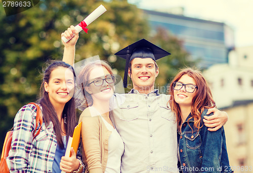 Image of students or teenagers with files and diploma