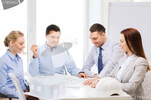 Image of happy team of architects and designers in office