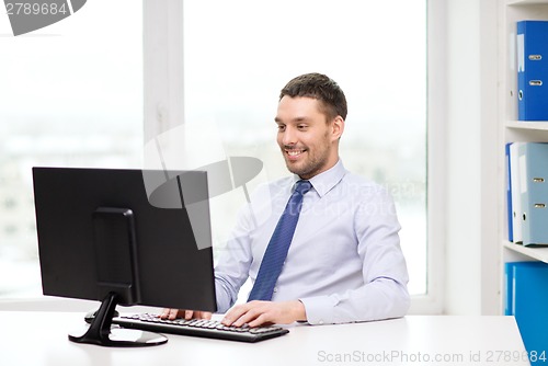 Image of smiling businessman or student with computer