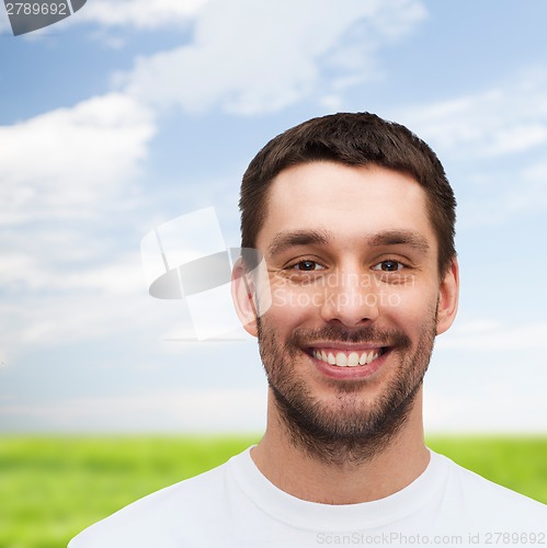 Image of portrait of smiling young handsome man