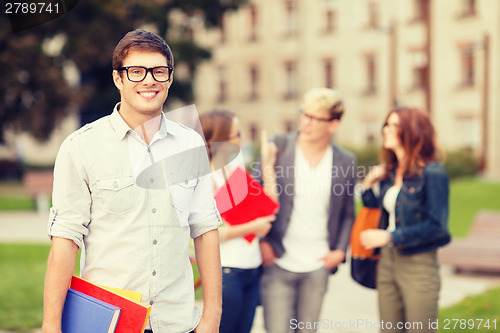 Image of teenage boy with classmates on the back