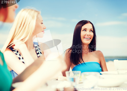 Image of girls in cafe on the beach