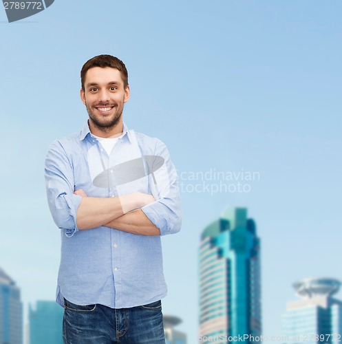 Image of smiling man with crossed arms