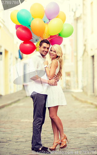 Image of couple with colorful balloons