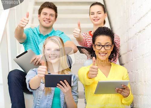 Image of smiling students with tablet pc computer