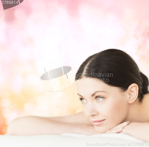 Image of smiling woman in spa salon