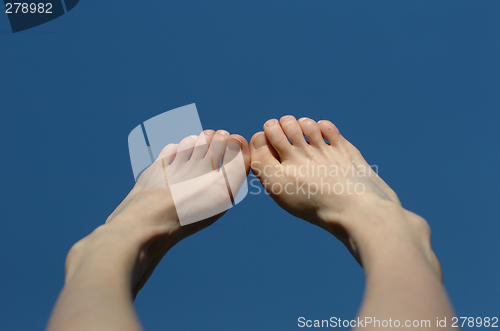 Image of feet on blue