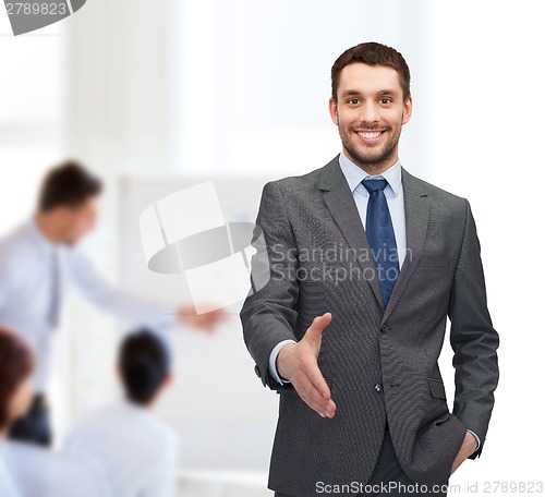 Image of businessman with open hand ready for handshake