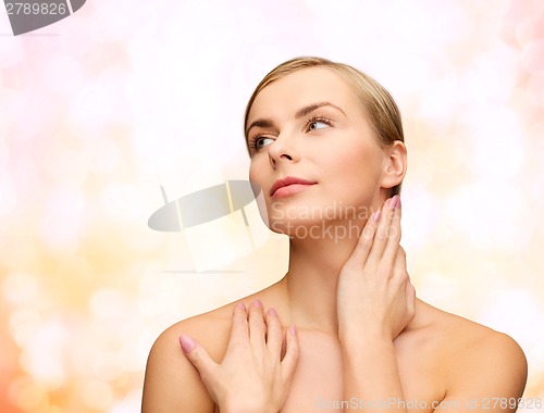 Image of face and hands of beautiful woman