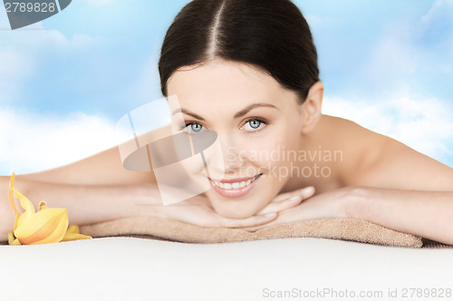 Image of smiling woman in spa salon